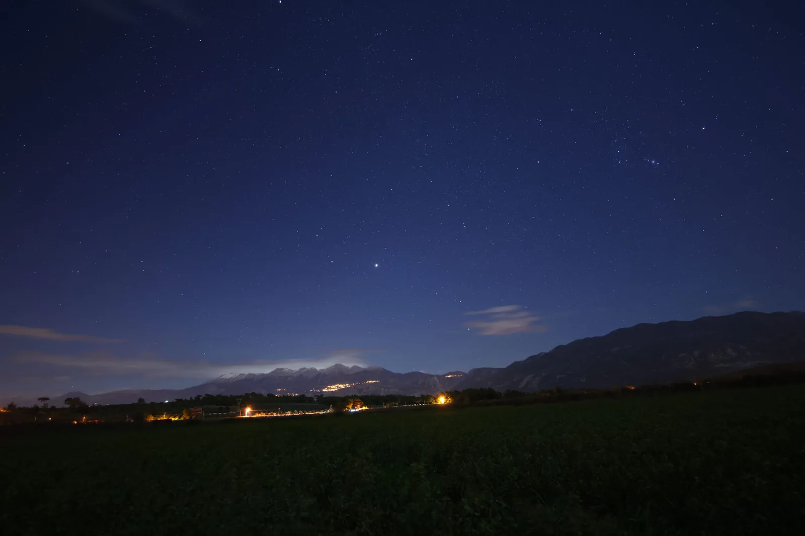 Starry night sky over mountain landscape during a field experience