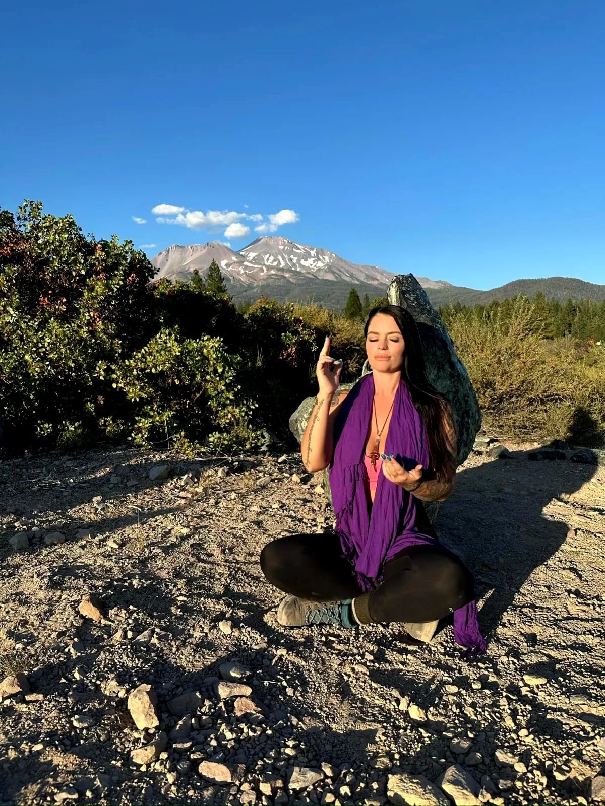Retreat participant on mountain landscape
